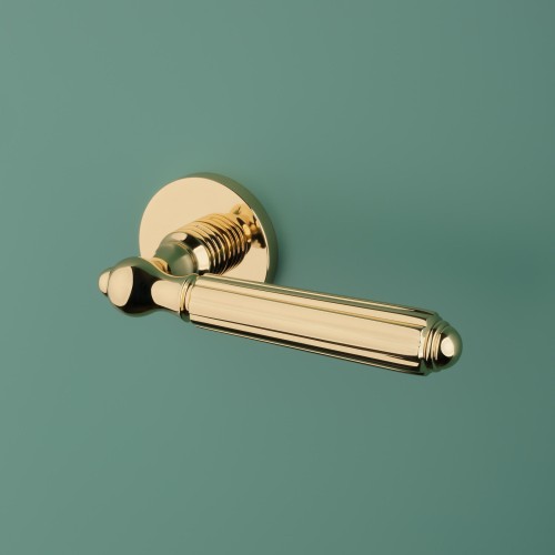 Klamka APRILE TIARELLA ROZETA R SLIM 7MM LG - złoty polerowany.Waga netto 1,155kg   Kolor Złoty polerowany  Kolekcja Prestige  Kształt rozety Okrągła R SLIM 7 mm  Materiał Mosiądz  Producent ENGER  Marka APRILE  Grubość rozety 7 mm fi 52 mm